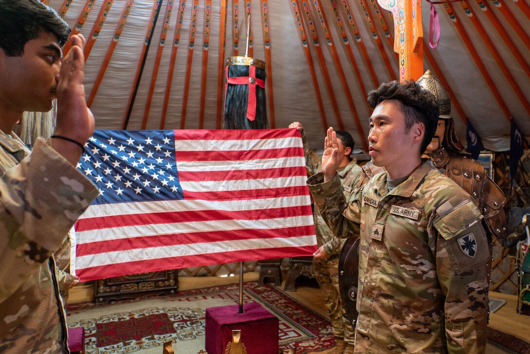 U.S. Army Sgt. Munk Munkhzaya, a finance technician assigned to the 125th Finance Battalion, 8th Theater Sustainment Command, recites the Oath of Enlistment during his reenlistment ceremony inside a traditional Mongolian ger at Five Hills Training Area, Mongolia, July 2, 2026.