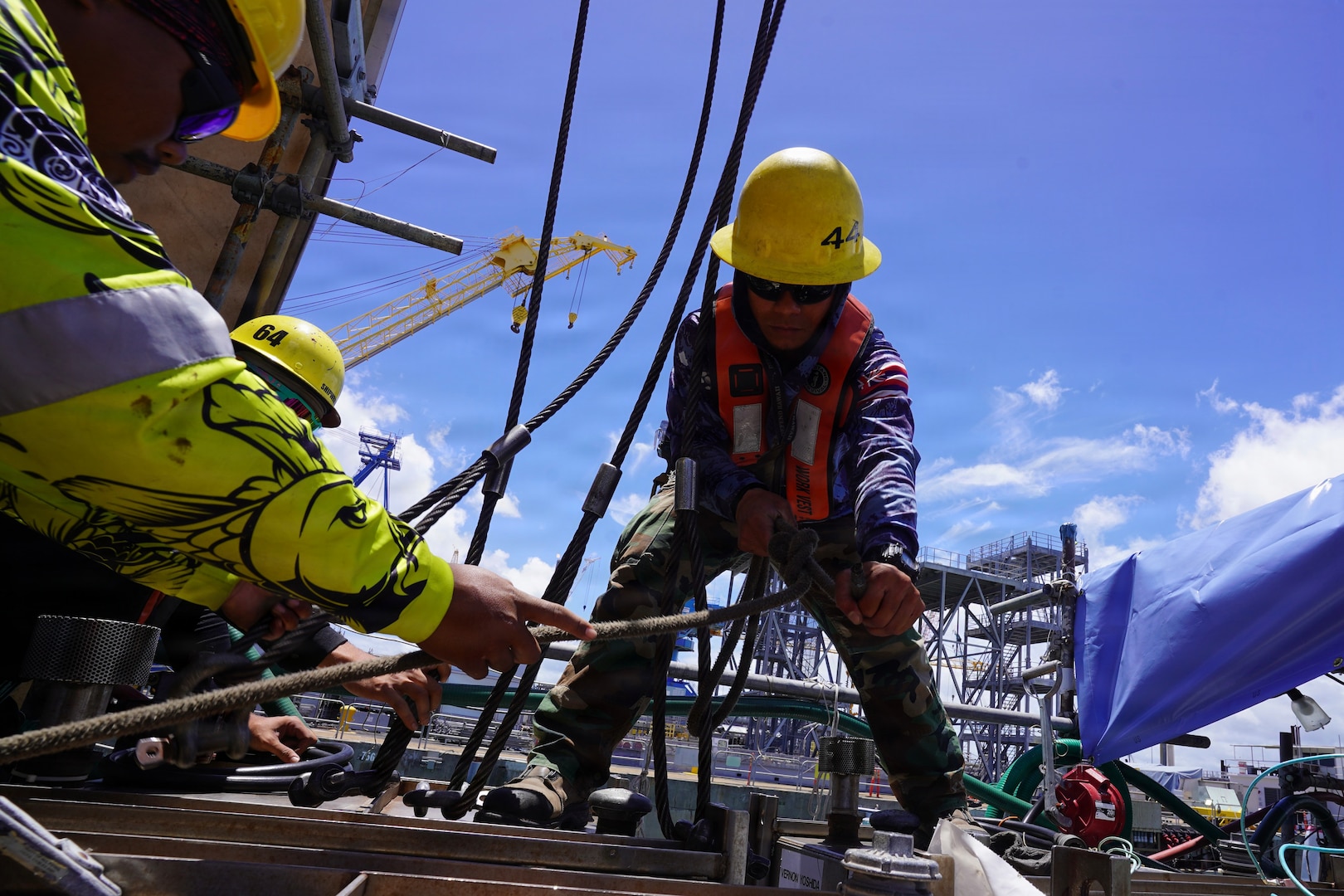 Joshua Kaahanui and Blake Tadaki, shipwrights with Pearl Harbor Naval Shipyard and Intermediate Maintenance Facility (PHNSY & IMF), rig a container off USS Illinois (SSN 786) at Joint Base Pearl Harbor-Hickam, June 24, 2026.