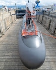 Virginia-class fast-attack submarine USS Illinois (SSN 786) in Dry Dock 2 as it prepares to undock at Pearl Harbor Naval Shipyard and Intermediate Maintenance Facility (PHNSY & IMF), June 23, 2026, completing an important milestone in the submarine’s scheduled lifecycle maintenance period. Commissioned Oct. 29, 2016, Illinois is the 13th Virginia-class submarine. It is the second U.S. Navy ship to be named for the state of Illinois. Illinois is assigned to Submarine Squadron 1 and is capable of supporting various missions, including anti-submarine warfare; anti-surface ship warfare; strike warfare; special operations forces support; and intelligence, surveillance, and reconnaissance. PHNSY & IMF’s mission is to keep the Navy’s fleet “Fit to Fight" by repairing, maintaining, and modernizing the Navy's fast-attack submarines and surface ships. Strategically located in the heart of the Pacific, it is the most comprehensive fleet repair and maintenance facility between the U.S. West Coast and the Far East. (U.S. Navy photo by Mike Wilson)