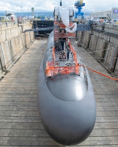 Virginia-class fast-attack submarine USS Illinois (SSN 786) in Dry Dock 2 as it prepares to undock at Pearl Harbor Naval Shipyard and Intermediate Maintenance Facility (PHNSY & IMF), June 23, 2026, completing an important milestone in the submarine’s scheduled lifecycle maintenance period. Commissioned Oct. 29, 2016, Illinois is the 13th Virginia-class submarine. It is the second U.S. Navy ship to be named for the state of Illinois. Illinois is assigned to Submarine Squadron 1 and is capable of supporting various missions, including anti-submarine warfare; anti-surface ship warfare; strike warfare; special operations forces support; and intelligence, surveillance, and reconnaissance. PHNSY & IMF’s mission is to keep the Navy’s fleet “Fit to Fight" by repairing, maintaining, and modernizing the Navy's fast-attack submarines and surface ships. Strategically located in the heart of the Pacific, it is the most comprehensive fleet repair and maintenance facility between the U.S. West Coast and the Far East. (U.S. Navy photo by Mike Wilson)