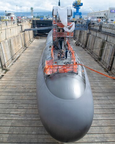 Virginia-class fast-attack submarine USS Illinois (SSN 786) in Dry Dock 2 as it prepares to undock at Pearl Harbor Naval Shipyard and Intermediate Maintenance Facility (PHNSY & IMF), June 23, 2026, completing an important milestone in the submarine’s scheduled lifecycle maintenance period. Commissioned Oct. 29, 2016, Illinois is the 13th Virginia-class submarine. It is the second U.S. Navy ship to be named for the state of Illinois. Illinois is assigned to Submarine Squadron 1 and is capable of supporting various missions, including anti-submarine warfare; anti-surface ship warfare; strike warfare; special operations forces support; and intelligence, surveillance, and reconnaissance. PHNSY & IMF’s mission is to keep the Navy’s fleet “Fit to Fight" by repairing, maintaining, and modernizing the Navy's fast-attack submarines and surface ships. Strategically located in the heart of the Pacific, it is the most comprehensive fleet repair and maintenance facility between the U.S. West Coast and the Far East. (U.S. Navy photo by Mike Wilson)