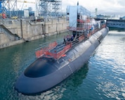 Virginia-class fast-attack submarine USS Illinois (SSN 786) sits in a partially flooded Dry Dock 2 as it prepares to undock at Pearl Harbor Naval Shipyard and Intermediate Maintenance Facility (PHNSY & IMF), June 24, 2026, completing an important milestone in the submarine’s scheduled lifecycle maintenance period. Commissioned Oct. 29, 2016, Illinois is the 13th Virginia-class submarine. It is the second U.S. Navy ship to be named for the state of Illinois. Illinois is assigned to Submarine Squadron 1 and is capable of supporting various missions, including anti-submarine warfare; anti-surface ship warfare; strike warfare; special operations forces support; and intelligence, surveillance, and reconnaissance. PHNSY & IMF’s mission is to keep the Navy’s fleet “Fit to Fight" by repairing, maintaining, and modernizing the Navy's fast-attack submarines and surface ships. Strategically located in the heart of the Pacific, it is the most comprehensive fleet repair and maintenance facility between the U.S. West Coast and the Far East. (U.S. Navy photo by Mike Wilson)