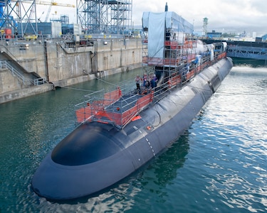 Virginia-class fast-attack submarine USS Illinois (SSN 786) sits in a partially flooded Dry Dock 2 as it prepares to undock at Pearl Harbor Naval Shipyard and Intermediate Maintenance Facility (PHNSY & IMF), June 24, 2026, completing an important milestone in the submarine’s scheduled lifecycle maintenance period. Commissioned Oct. 29, 2016, Illinois is the 13th Virginia-class submarine. It is the second U.S. Navy ship to be named for the state of Illinois. Illinois is assigned to Submarine Squadron 1 and is capable of supporting various missions, including anti-submarine warfare; anti-surface ship warfare; strike warfare; special operations forces support; and intelligence, surveillance, and reconnaissance. PHNSY & IMF’s mission is to keep the Navy’s fleet “Fit to Fight" by repairing, maintaining, and modernizing the Navy's fast-attack submarines and surface ships. Strategically located in the heart of the Pacific, it is the most comprehensive fleet repair and maintenance facility between the U.S. West Coast and the Far East. (U.S. Navy photo by Mike Wilson)