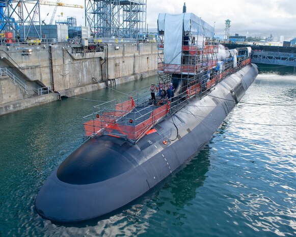 Virginia-class fast-attack submarine USS Illinois (SSN 786) sits in a partially flooded Dry Dock 2 as it prepares to undock at Pearl Harbor Naval Shipyard and Intermediate Maintenance Facility (PHNSY & IMF), June 24, 2026, completing an important milestone in the submarine’s scheduled lifecycle maintenance period. Commissioned Oct. 29, 2016, Illinois is the 13th Virginia-class submarine. It is the second U.S. Navy ship to be named for the state of Illinois. Illinois is assigned to Submarine Squadron 1 and is capable of supporting various missions, including anti-submarine warfare; anti-surface ship warfare; strike warfare; special operations forces support; and intelligence, surveillance, and reconnaissance. PHNSY & IMF’s mission is to keep the Navy’s fleet “Fit to Fight" by repairing, maintaining, and modernizing the Navy's fast-attack submarines and surface ships. Strategically located in the heart of the Pacific, it is the most comprehensive fleet repair and maintenance facility between the U.S. West Coast and the Far East. (U.S. Navy photo by Mike Wilson)