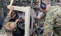 Building on the success of RIMPAC 2024, NPS’ Consortium for Advanced Manufacturing Research and Education (CAMRE) is heading back to Hawaii for RIMPAC 2026 with their largest, most ambitious at sea effort to date, including state-of-the-art advanced manufacturing (AM) systems aboard multiple ships and ashore, as the team explores cutting-edge AM capabilities, networks and advanced operations integrated with autonomous vehicles. Pictured here, the CAMRE team produced and installed a 3D-printed stainless steel reverse osmosis pump sprocket bushing aboard USS Somerset (LPD 25) during RIMPAC 2024 to keep the ship fully operational. (U.S. Marine Corps photo)