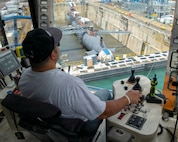 Dane Montez, a crane operator with Pearl Harbor Naval Shipyard and Intermediate Maintenance Facility (PHNSY & IMF), assists with the undocking of Virginia-class fast-attack submarine USS Illinois (SSN 786) as Dry Dock 2 floods at PHNSY & IMF, June 23, 2026.