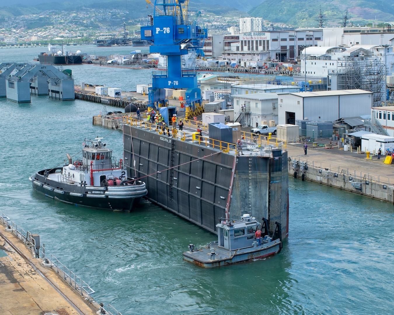 A caisson is removed from Dry Dock 2 as Virginia-class fast-attack submarine USS Illinois (SSN 786) prepares to undock at Pearl Harbor Naval Shipyard and Intermediate Maintenance Facility (PHNSY & IMF), June 24, 2026