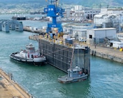 A caisson is removed from Dry Dock 2 as Virginia-class fast-attack submarine USS Illinois (SSN 786) prepares to undock at Pearl Harbor Naval Shipyard and Intermediate Maintenance Facility (PHNSY & IMF), June 24, 2026