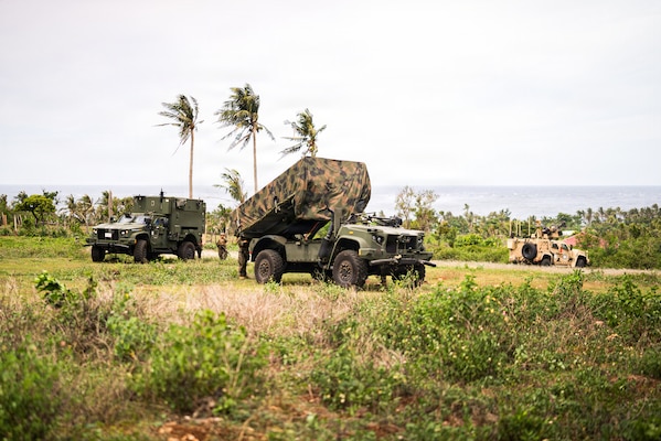 From left, a Mobile Command Vehicle, a Navy-Marine Expeditionary Ship Interdiction System and a Marine Air Defense Integrated System, all assigned to 3rd Marine Littoral Regiment, 3rd Marine Division, conduct a simulated NMESIS firing mission during KAMANDAG 10 at Calayan, Philippines, June 25, 2026.