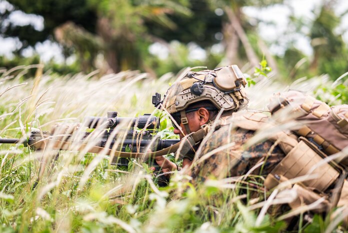 U.S. Marine Corps Lance Cpl. Armando Netzahuatl, a combat engineer assigned to 3rd Littoral Combat Team, 3rd Marine Littoral Regiment, 3rd Marine Division, secures key terrain in support of Navy-Marine Expeditionary Ship Interdiction System firing mission during KAMANDAG 10 at Calayan, Philippines, June 25, 2026.