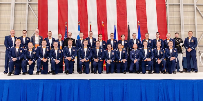 USAF Test Pilot School Class 25B students pose for a portrait following their graduation at Edwards Air Force Base, June 5. The graduating class includes USAF Airmen, USSF Guardians and exchange students representing the Royal Air Force and Hellenic Air Force. (U.S. Air Force photo by Lindsey Iniguez)