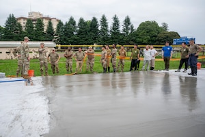 The gathering marked the completion of a 67-day deployment for training between the 374th Civil Engineer Squadron and the National Guard Bureau to build the pad and hone Guardsmen's upgrade training skills.