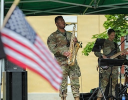 U.S. Army Sgt. Carlos Dela, a saxophonist assigned to the 1st Infantry Division Band, performs on stage during a musical set for spectators during the South-Estonia Rally in Võru, Estonia, July 4, 2026. Through music, Soldiers and local communities come together in shared moments that build trust, foster understanding, and reflect the enduring strength of NATO partnerships wherever we serve. V Corps is the U.S. Army's only forward-deployed corps, serving as the senior tactical headquarters for Army forces in Eastern Europe to deter conflict and provide combat-ready forces alongside our NATO Allies. V Corps is operationalizing and expanding the Eastern Flank Deterrence Initiative with Allies, rapidly integrating emerging technologies into training and tactical plans. (U.S. Army photo by Sgt. Aaron Kaczur, 196th Mobile Public Affairs Detachment)
