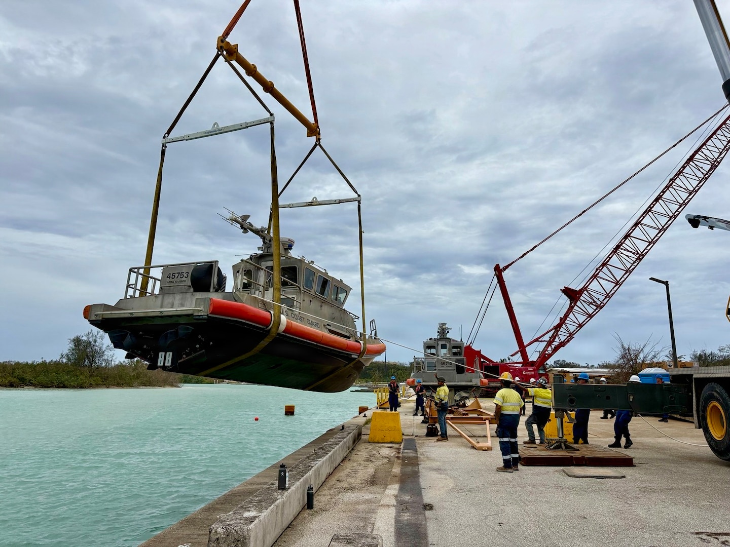 On July 8, 2026, U.S. Coast Guard crews continue to assess and work to rectify aids to navigation, waterways, and channel conditions across the Marianas following Super Typhoon Bavi, working toward reopening ports to commercial operations as soon as it is safe to do so. (U.S. Coast Guard photo)