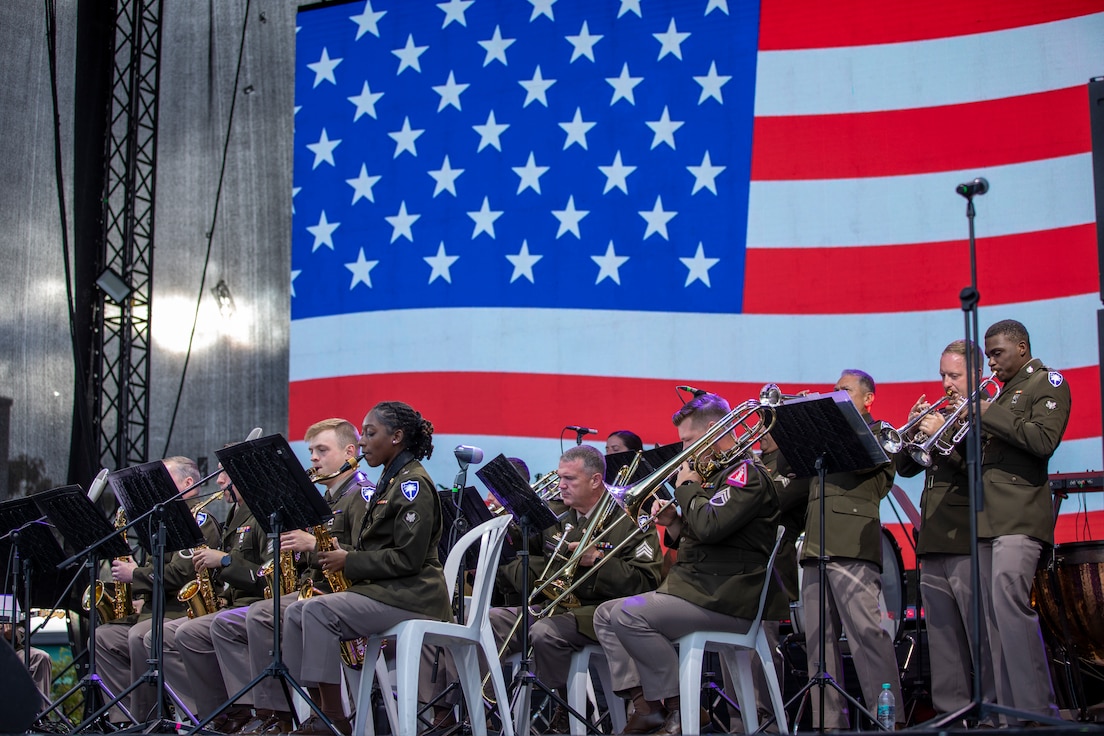 band members playing in front of an american flag