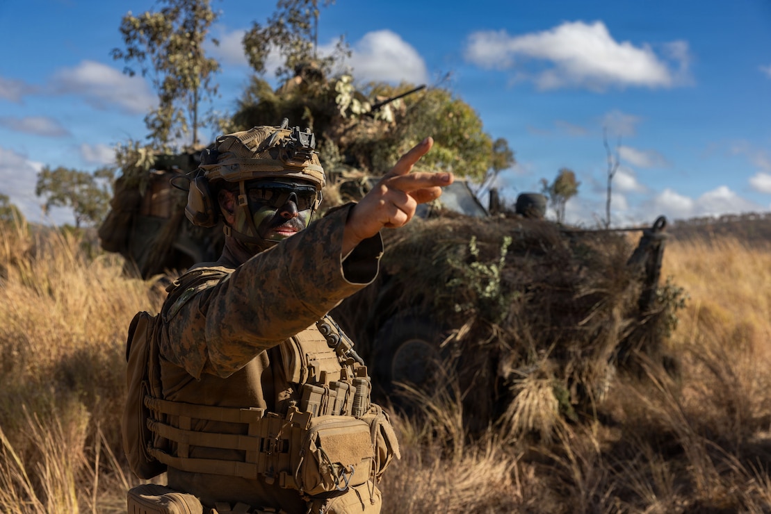 U.S. Marine Corps 1st Lt. Martin Belden, a platoon commander with Weapons Company, 1st Battalion, 5th Marine Regiment, Marine Rotational Force – Darwin 26, points at a target in preparation for a live-fire range as part of Exercise Southern Jackaroo at Townsville Field Training Area in Queensland, Australia, July 1, 2026. Exercise Southern Jackaroo is a trilateral training event between the armed forces of Australia, Japan, and the United States that builds combined combat readiness and interoperability in the Indo-Pacific through joint operations and live-fire training. Belden is a native of Montana. (U.S. Marine Corps photo by Sgt. Kyle Chan)