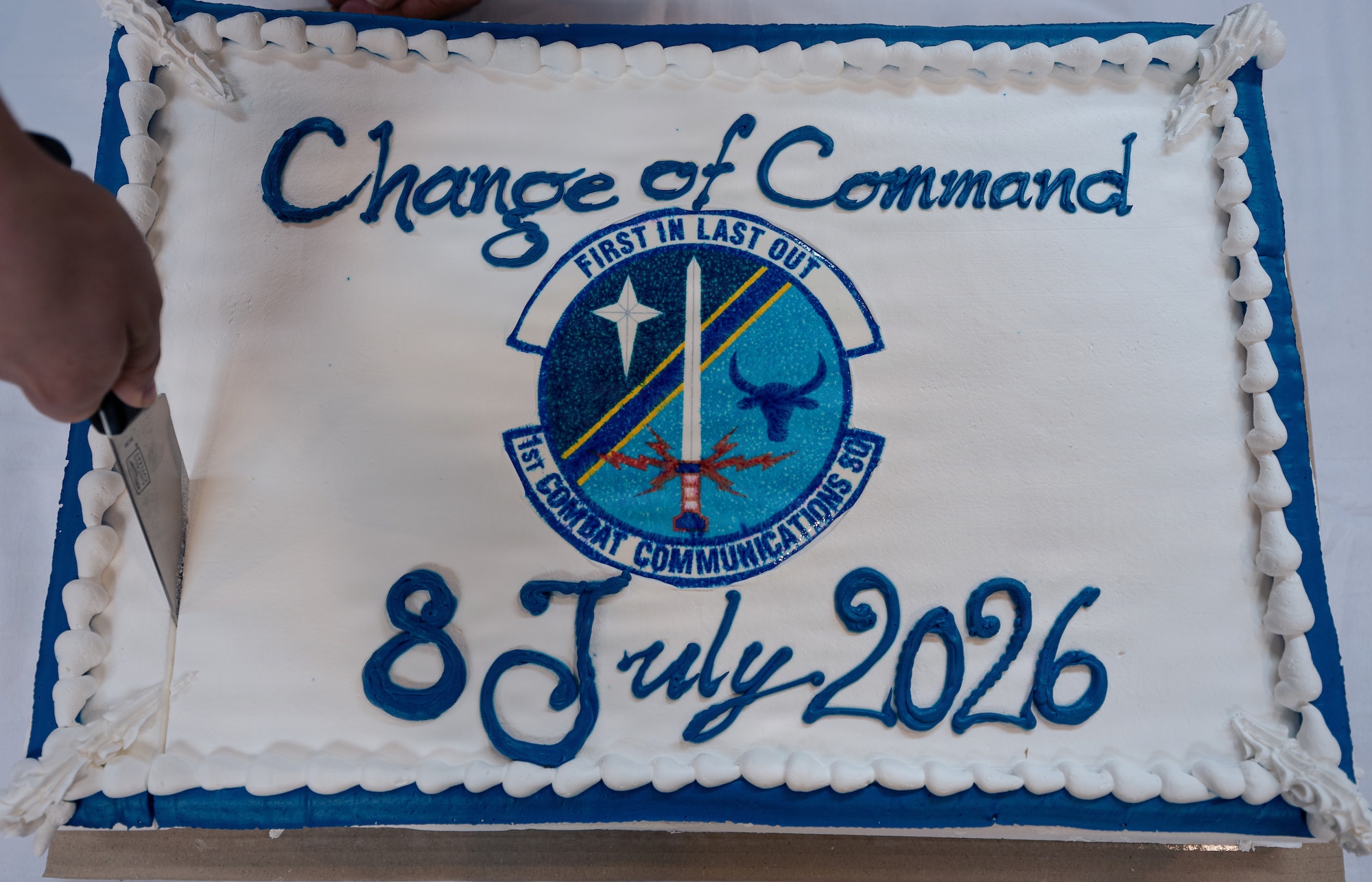 airman cuts a cake
