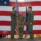U.S. Air Force Col. Jesse Lamarand, 5th Bomb Wing commander, left, relinquishes the guidon to U.S. Air Force Col. Bryson Ayers 5th Operations Group (OG) incoming commander, right, during a change of command ceremony at Minot Air Force Base, North Dakota, July 7, 2026. As the incoming commander, Ayers will be directly responsible for the people who fly the B-52's at Minot, making sure the aircraft, crews and operational systems are prepared, certified and ready to execute the nation's strategic bomber mission at any time.