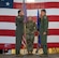 U.S. Air Force Col. Jesse Lamarand, 5th Bomb Wing commander, left, relinquishes the guidon to U.S. Air Force Col. Bryson Ayers 5th Operations Group (OG) incoming commander, right, during a change of command ceremony at Minot Air Force Base, North Dakota, July 7, 2026. As the incoming commander, Ayers will be directly responsible for the people who fly the B-52's at Minot, making sure the aircraft, crews and operational systems are prepared, certified and ready to execute the nation's strategic bomber mission at any time.