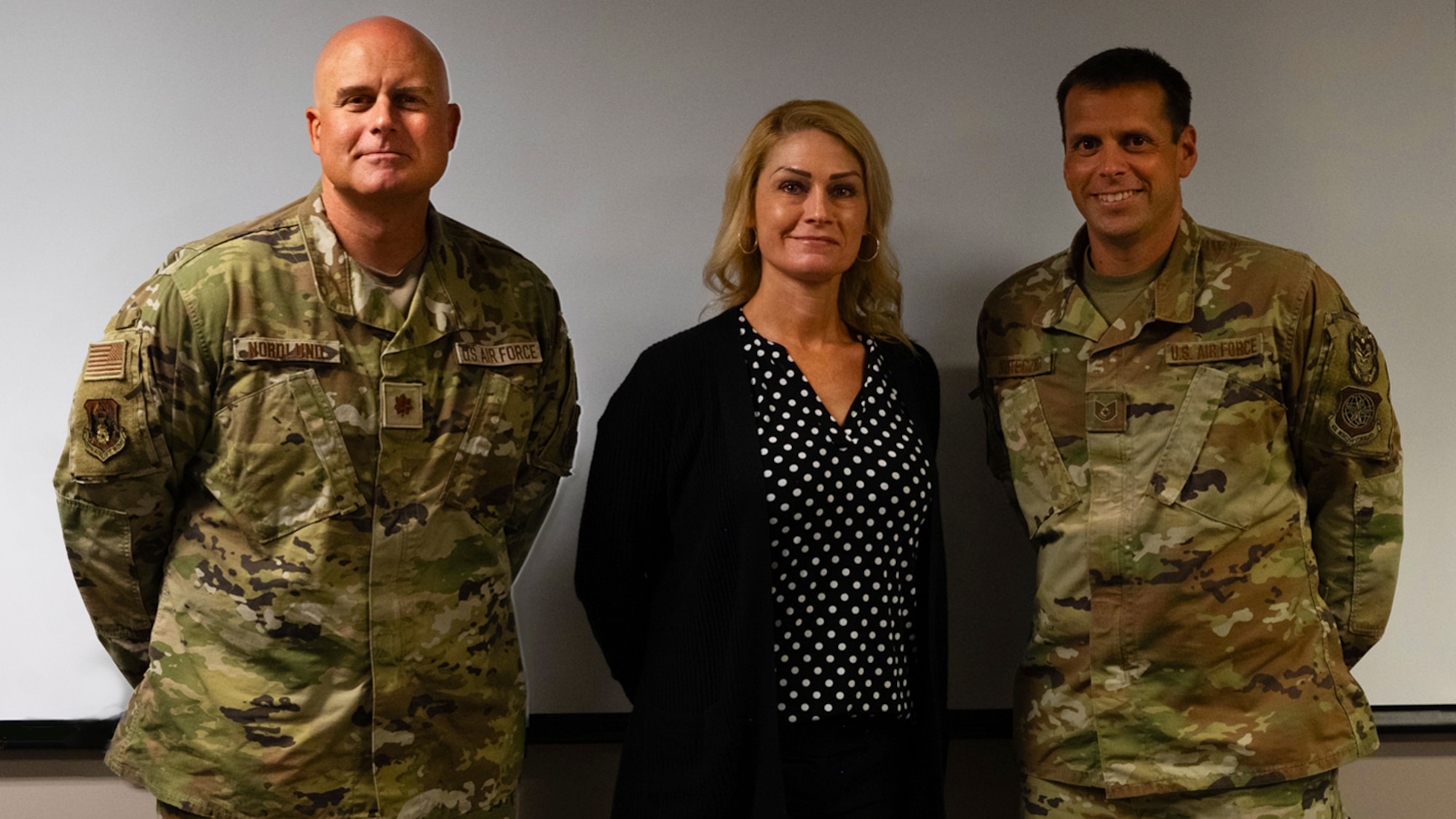 Three members of IG pose for a photo.