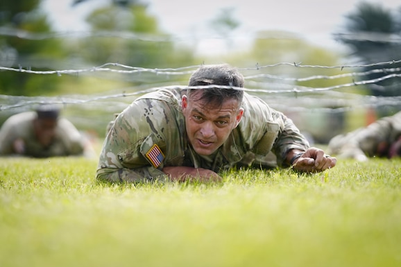 An Army Reserve Best Squad competitor low crawls while completing a physical fitness assessment at Fort McCoy Wisconsin, May 23, 2026. One hundred Soldiers from around the nation are competing in the 2026 BSC, an annual competition that brings together the best Soldiers and squads from across the U.S. Army Reserve to earn the title of “Best Warrior” and “Best Squad” among their peers. (U.S. Army Reserve photo by Master Sgt. Crystal Harlow)