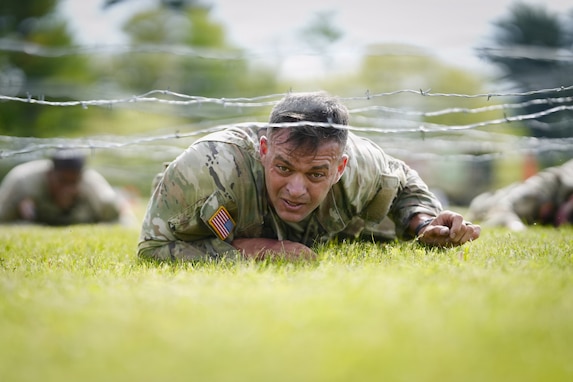 An Army Reserve Best Squad competitor low crawls while completing a physical fitness assessment at Fort McCoy Wisconsin, May 23, 2026. One hundred Soldiers from around the nation are competing in the 2026 BSC, an annual competition that brings together the best Soldiers and squads from across the U.S. Army Reserve to earn the title of “Best Warrior” and “Best Squad” among their peers. (U.S. Army Reserve photo by Master Sgt. Crystal Harlow)