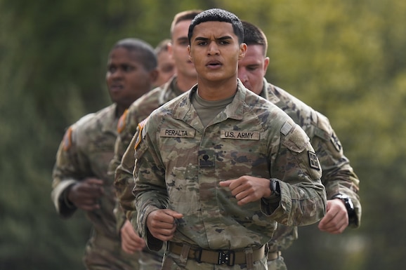 Army Reserve Best Squad competitors run a half mile as a squad while completing a physical fitness assessment at Fort McCoy Wisconsin, May 23, 2026. One hundred Soldiers from around the nation are competing in the 2026 BSC, an annual competition that brings together the best Soldiers and squads from across the U.S. Army Reserve to earn the title of “Best Warrior” and “Best Squad” among their peers. (U.S. Army Reserve photo by Master Sgt. Crystal Harlow)