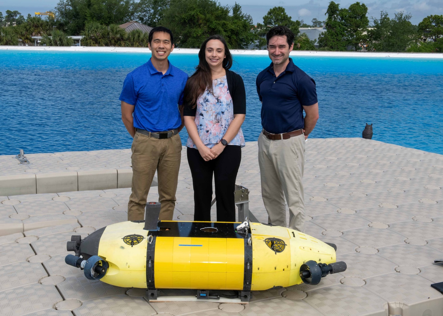 Members of the Mission Effectiveness & Assessment with Subsea Recognition (MEASUR) team (from left) Dr. Spencer Chang, Dr. Adriana McKinney and Dr. Tony Diaz, are shown with the Science & Technology Engineering Innovation Vehicle, or STEIV, at NSWC Panama City Division’s test pond. By equipping unmanned underwater vehicles with advanced sensors and artificial intelligence, MEASUR automatically and accurately evaluates physical damage to underwater threats. (Not pictured) Dr. Kwang Lee, Peter Romaine and Dr. Minh Chau. (U.S. Navy photo by Ronnie Newsome)
