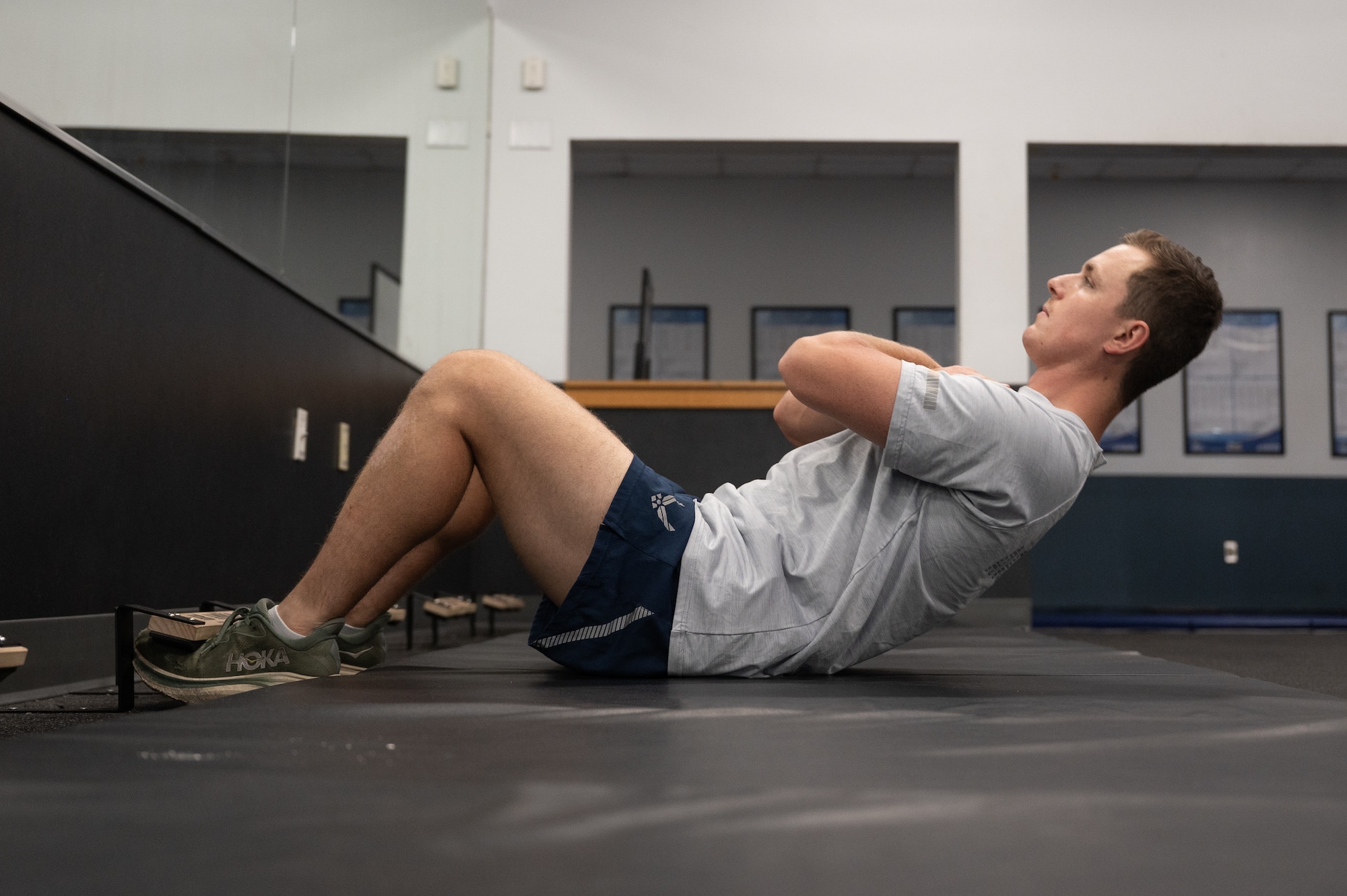 A U.S. Airmen performs a sit-up.