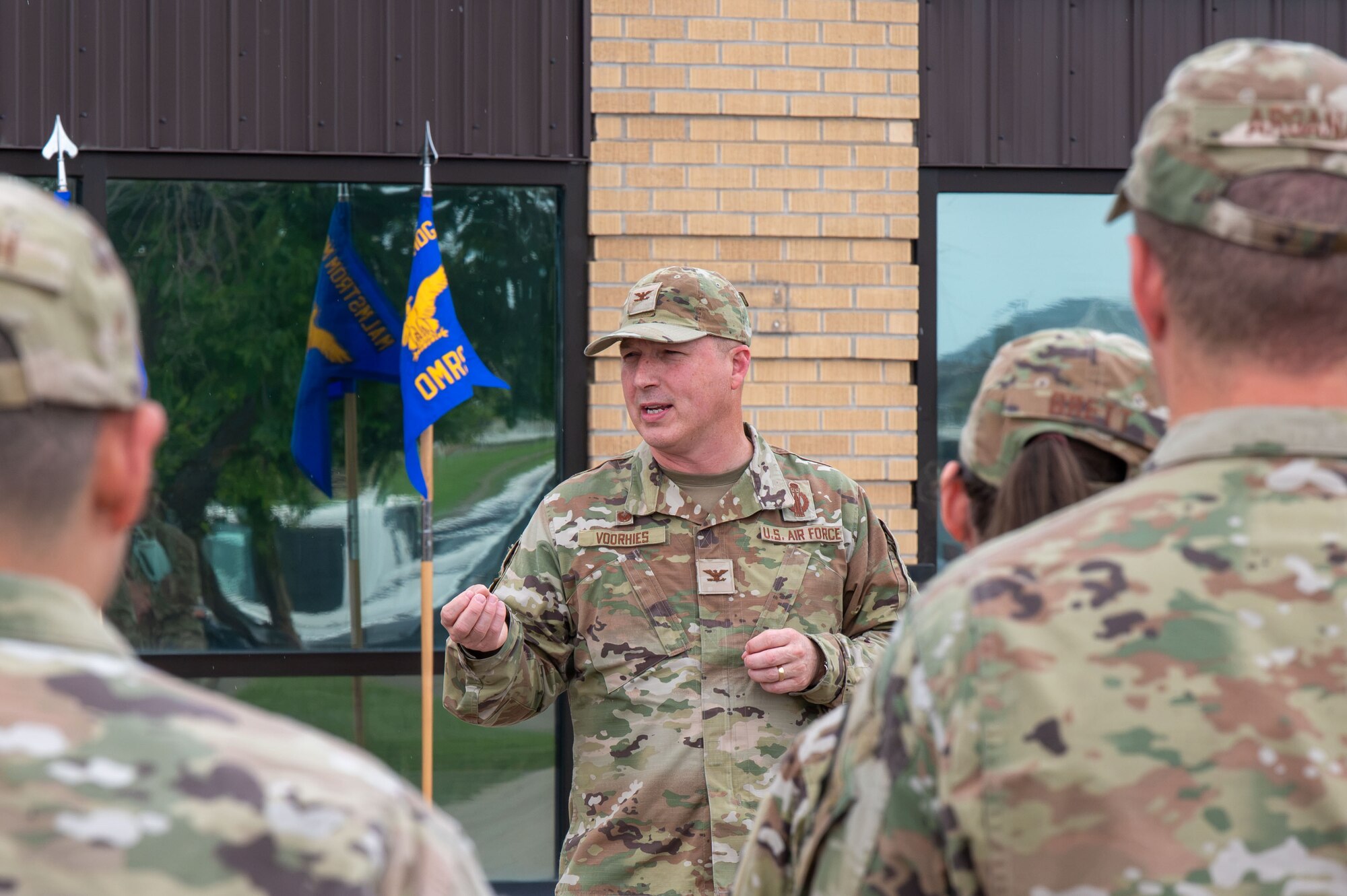 U.S. Air Force Col. Daniel Voorhies, 341st Missile Wing commander, provides remarks to Malmstrom Medical Group Airmen during the Air Force Medical Command’s fourth inter-command transfer, at Malmstrom Air Force Base, Montana, June 26, 2026.