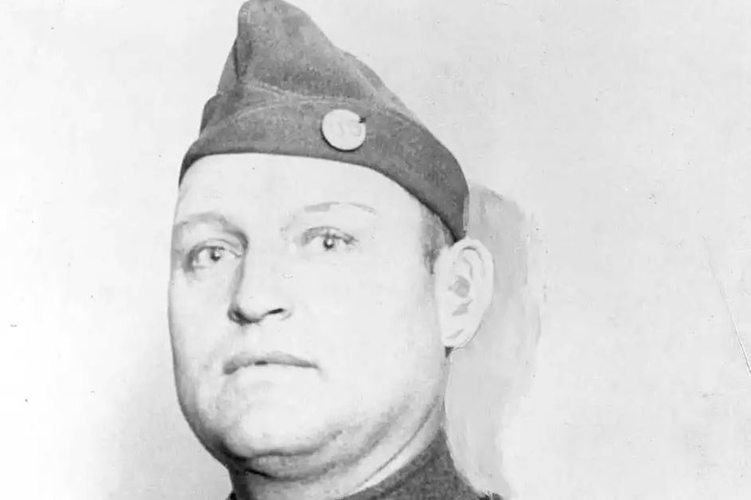 A man wearing a military hat.