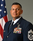 photo of Chief Jamie Wiesner standing in front of a US flag