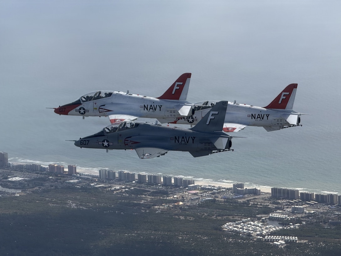 A T-45C Goshawk aircraft assigned to Training Squadron (VT) 86 conducts a Close Air Support (CAS) training and completion flight over Naval Air Station (NAS) Pensacola, February 26, 2026. Chief of Naval Air Training (CNATRA) trains, mentors, and delivers the highest quality Naval Aviators that win in competition, crisis, and conflict. (U.S. Navy photo by Lt. Garrett Booth)