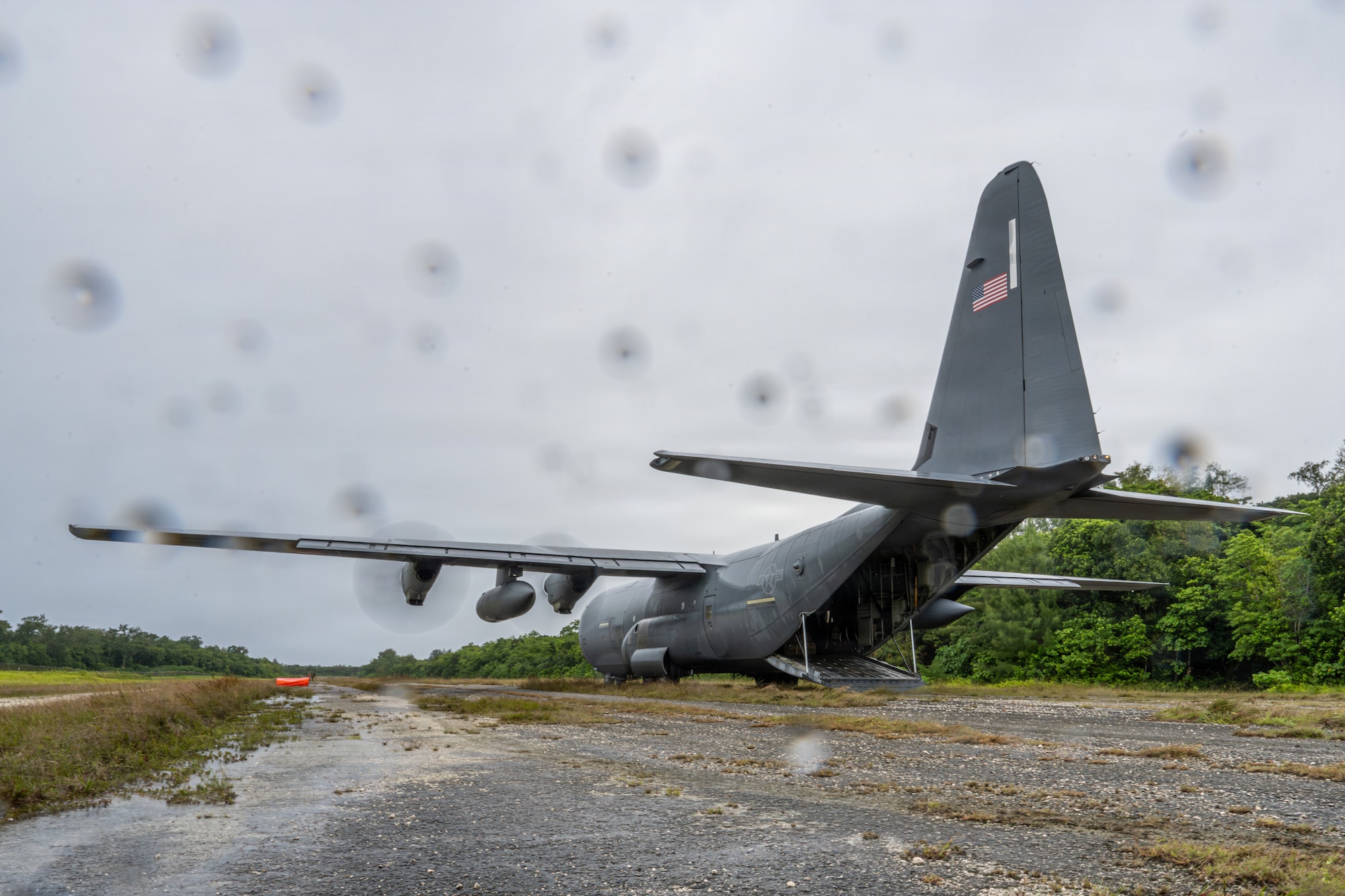 A C-130J Super Hercules arrives to pick up U.S. service members at Ngeaur Island, Palau, June 25, 2026, in support of VALIANT SHIELD 2026. Exercises like VALIANT SHIELD allow Pacific Command Joint Forces the opportunity to integrate forces from all branches of service and with our allies to conduct precise, lethal, and overwhelming multi-axis, multi-domain effects that demonstrate the strength and versatility of the joint force and our commitment to a free and open Indo-Pacific. (U.S. Air Force photo by Airman 1st Class Caleb Schellenberg)