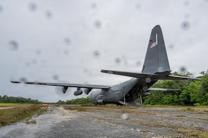 A C-130J Super Hercules arrives to pick up U.S. service members at Ngeaur Island, Palau, June 25, 2026, in support of VALIANT SHIELD 2026. Exercises like VALIANT SHIELD allow Pacific Command Joint Forces the opportunity to integrate forces from all branches of service and with our allies to conduct precise, lethal, and overwhelming multi-axis, multi-domain effects that demonstrate the strength and versatility of the joint force and our commitment to a free and open Indo-Pacific. (U.S. Air Force photo by Airman 1st Class Caleb Schellenberg)