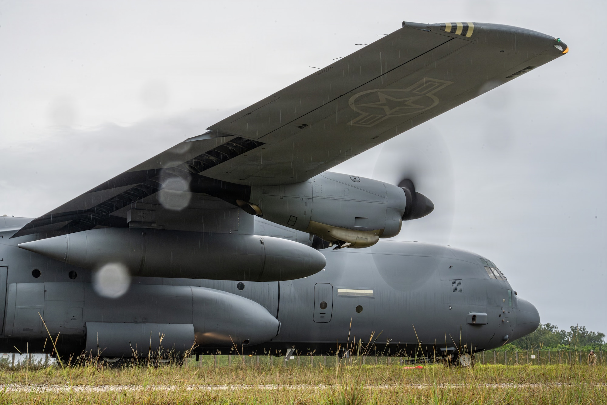 A C-130J Super Hercules arrives to pick up U.S. service members at Ngeaur Island, Palau, June 25, 2026, in support of VALIANT SHIELD 2026. Exercises like VALIANT SHIELD allow Pacific Command Joint Forces the opportunity to integrate forces from all branches of service and with our allies to conduct precise, lethal, and overwhelming multi-axis, multi-domain effects that demonstrate the strength and versatility of the joint force and our commitment to a free and open Indo-Pacific. (U.S. Air Force photo by Airman 1st Class Caleb Schellenberg)