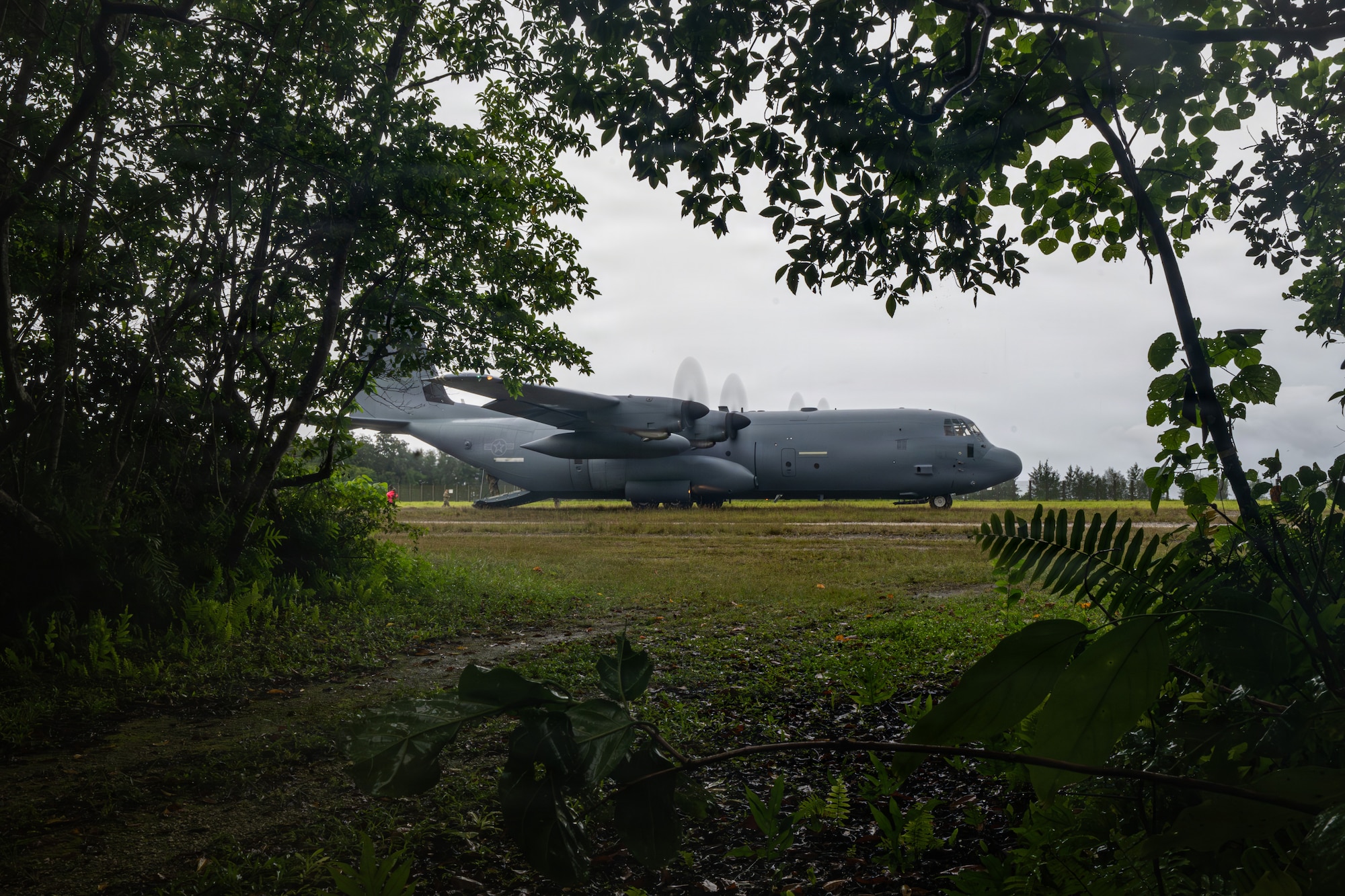 A C-130J Super Hercules arrives to pick up U.S. service members at Ngeaur Island, Palau, June 25, 2026, in support of VALIANT SHIELD 2026. Exercises like VALIANT SHIELD allow Pacific Command Joint Forces the opportunity to integrate forces from all branches of service and with our allies to conduct precise, lethal, and overwhelming multi-axis, multi-domain effects that demonstrate the strength and versatility of the joint force and our commitment to a free and open Indo-Pacific. (U.S. Air Force photo by Airman 1st Class Caleb Schellenberg)