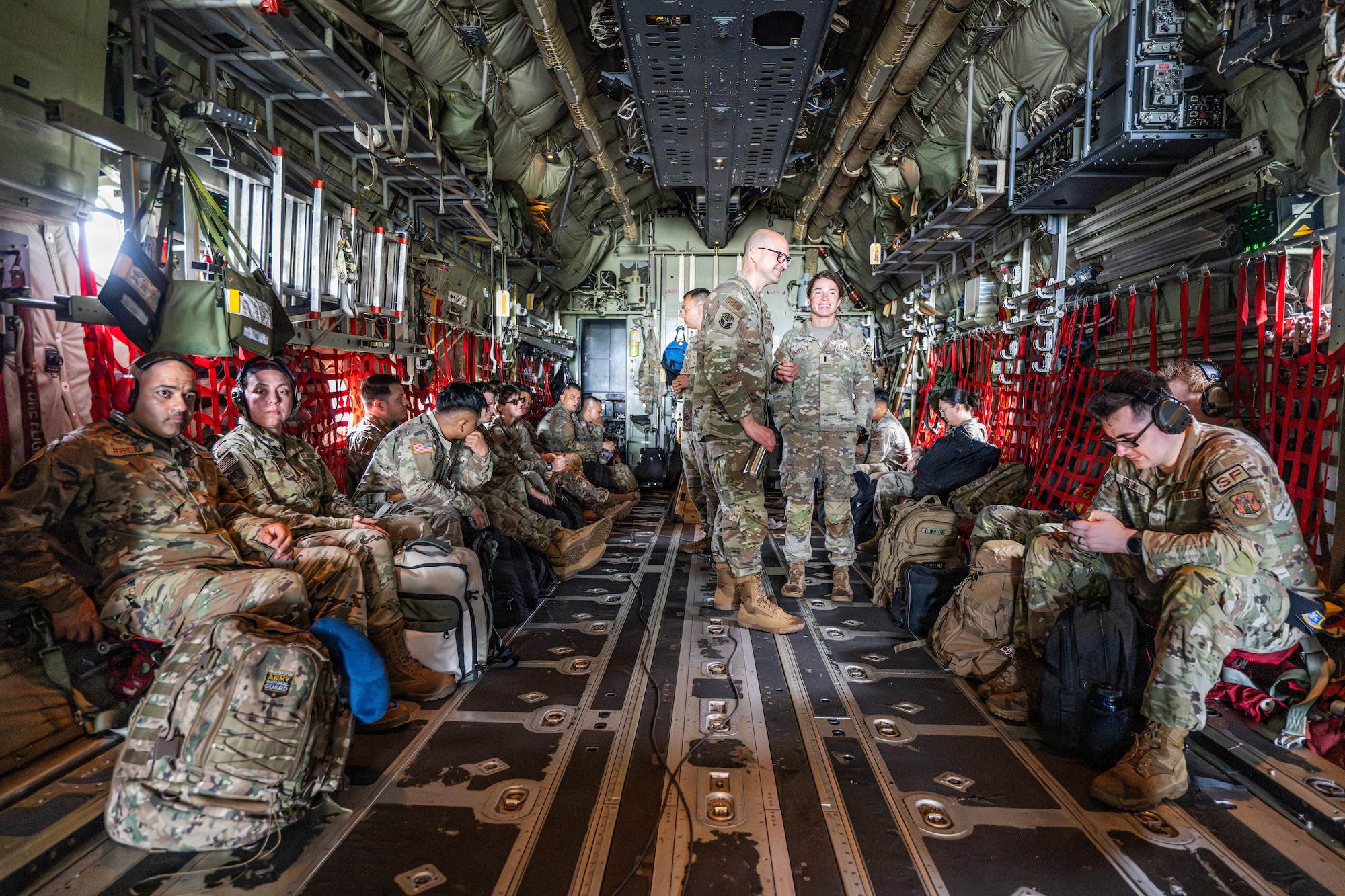 U.S. service members await departure aboard a C-130J Super Hercules at Ngeaur Island, Palau, June 25, 2026, in support of VALIANT SHIELD 2026. Exercises like VALIANT SHIELD allow Pacific Command Joint Forces the opportunity to integrate forces from all branches of service and with our allies to conduct precise, lethal, and overwhelming multi-axis, multi-domain effects that demonstrate the strength and versatility of the joint force and our commitment to a free and open Indo-Pacific. (U.S. Air Force photo by Airman 1st Class Caleb Schellenberg)
