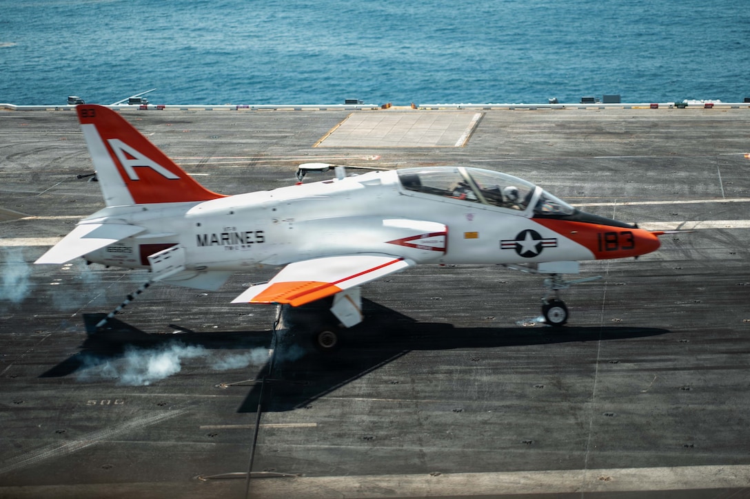 A U.S. Navy T-45C Goshawk jet trainer aircraft lands on the flight deck of Nimitz-class aircraft carrier USS Dwight D. Eisenhower (CVN 69), June 27, 2026. Eisenhower is underway in the Atlantic Ocean conducting carrier qualifications for student naval aviators assigned to Naval Air Training Command.(U.S. Navy photo by Mass Communication Specialist 2nd Class Miguel Santiago)