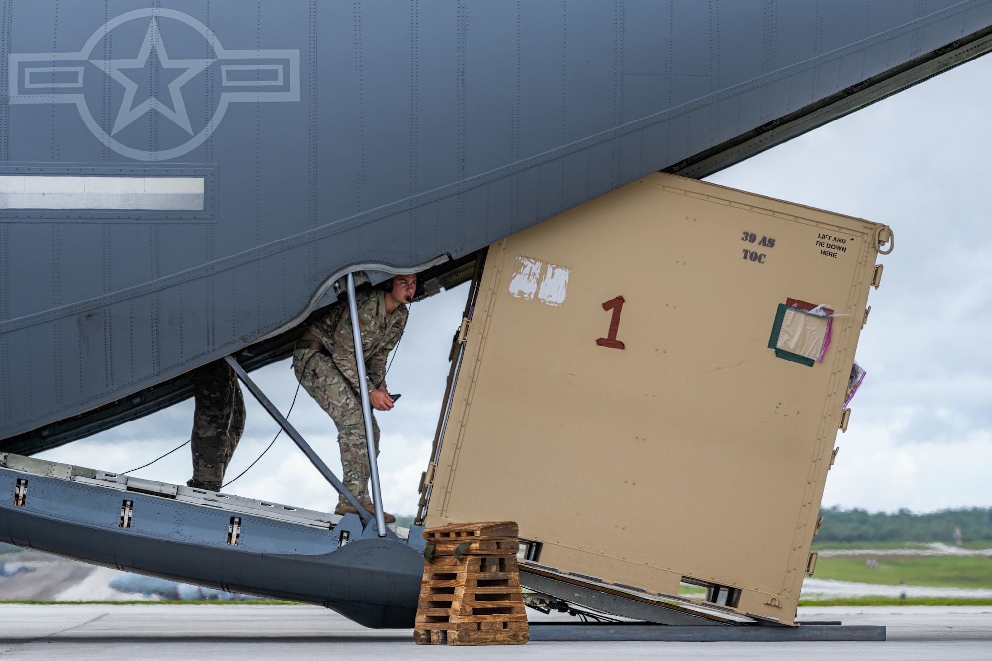 U.S. Airmen offload cargo from a C-130J Super Hercules during combat offload Method C training at Anderson Air Force Base, Guam, June 24, 2026, in support of VALIANT SHIELD 2026. Exercises like VALIANT SHIELD allow Pacific Command Joint Forces the opportunity to integrate forces from all branches of service and with our allies to conduct precise, lethal, and overwhelming multi-axis, multi-domain effects that demonstrate the strength and versatility of the joint force and our commitment to a free and open Indo-Pacific. (U.S. Air Force photo by Airman 1st Class Caleb Schellenberg)