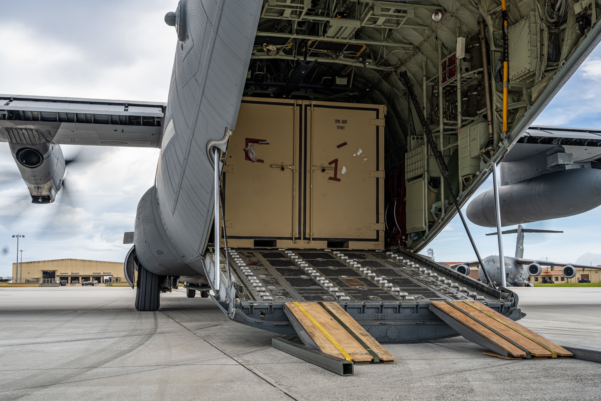 A C-130J Super Hercules is positioned for cargo offload during combat offload Method C training at Andersen Air Force Base, Guam, June 24, 2026, in support of VALIANT SHIELD 2026. Exercises like VALIANT SHIELD allow Pacific Command Joint Forces the opportunity to integrate forces from all branches of service and with our allies to conduct precise, lethal, and overwhelming multi-axis, multi-domain effects that demonstrate the strength and versatility of the joint force and our commitment to a free and open Indo-Pacific. (U.S. Air Force photo by Airman 1st Class Caleb Schellenberg)