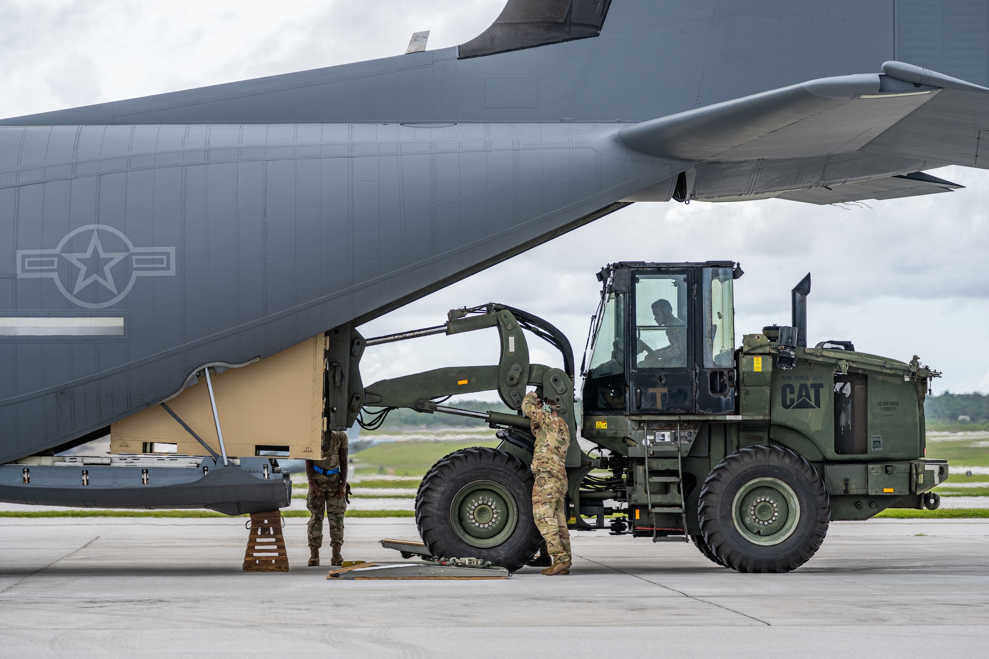 U.S. Airmen load cargo onto a C-130J Super Hercules during combat offload Method C training at Anderson Air Force Base, Guam, June 24, 2026, in support of VALIANT SHIELD 2026. Exercises like VALIANT SHIELD allow Pacific Command Joint Forces the opportunity to integrate forces from all branches of service and with our allies to conduct precise, lethal, and overwhelming multi-axis, multi-domain effects that demonstrate the strength and versatility of the joint force and our commitment to a free and open Indo-Pacific. (U.S. Air Force photo by Airman 1st Class Caleb Schellenberg)