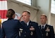U.S. Air Force Col. James Schlabach, outgoing 91st Missile Wing (91st MW) commander, middle, relinquishes command to U.S. Air Force Maj. Gen. Stacy Jo Huser, 20th Air Force commander, left, during a change of command at Minot Air Force Base, North Dakota, July 8, 2026. Schlabach reflected on the accomplishments of the 91st MW, praising the Airmen and staff that worked under his command for their dedication and work towards the mission of global deterrence. (U.S. Air Force photo by Senior Airman Wesley Davies)