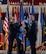 U.S. Air Force Col. George Chapman, incoming 91st Missile Wing (91st MW) commander, right, passes the 91st MW guidon to U.S. Air Force Maj. Gen. Stacy Jo Huser, 20th Air Force commander, left, during a change of command at Minot Air Force Base, North Dakota, July 8, 2026. The 91st MW is one of the Air Force's three operational missile units. The 91st MW maintains a fleet of Minuteman III intercontinental ballistic missiles and its mission is to defend the nation with a combat-ready nuclear force. (U.S. Air Force photo by Senior Airman Wesley Davies)