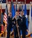 U.S. Air Force Col. James Schlabach, outgoing 91st Missile Wing (91st MW) commander, right, receives the 91st MW guidon from U.S. Air Force Maj. Gen. Stacy Jo Huser, 20th Air Force commander, left, assuming command of the 91st MW during a change of command ceremony at Minot Air Force Base, North Dakota, July 8, 2026. Schlabach reflected on the accomplishments of the 91st MW, praising the Airmen and staff that worked under his command for their dedication and work towards the mission of global deterrence. (U.S. Air Force photo by Senior Airman Wesley Davies)