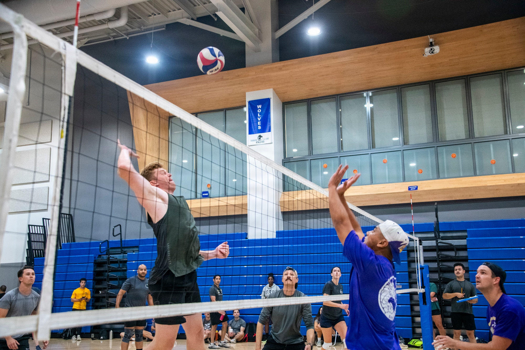 Members of Space System Delta 89, wearing grey, and Space System Delta 84, wearing blue, compete in volleyball during Los Angeles Air Force Base’s 2026 Sports Day at Da Vinci School in El Segundo, California, July 1, 2026.