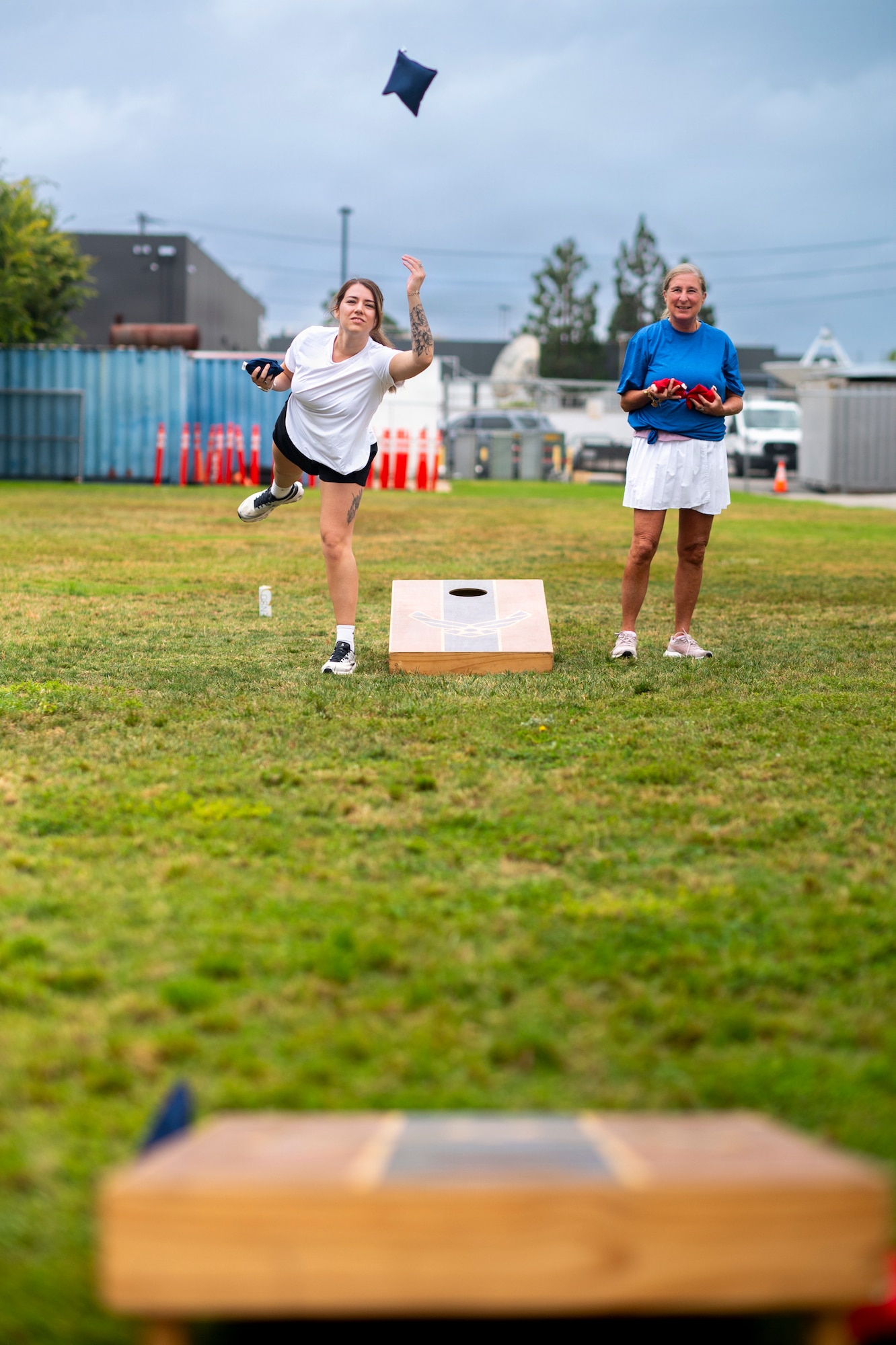 Members of Space System Delta 85, wearing white, and Space System Delta 84, wearing blue, compete in cornhole during Los Angeles Air Force Base’s 2026 Sports Day at Da Vinci School in El Segundo, California, July 1, 2026.