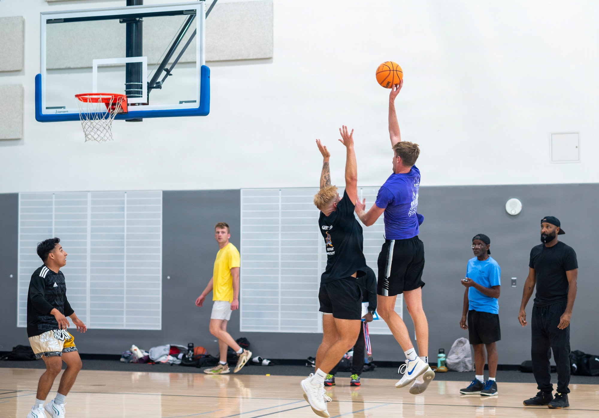 Members of Space System Delta 84, wearing blue, and Space System Delta 88, wearing black, compete in basketball during Los Angeles Air Force Base’s 2026 Sports Day at Da Vinci School in El Segundo, California, July 1, 2026.