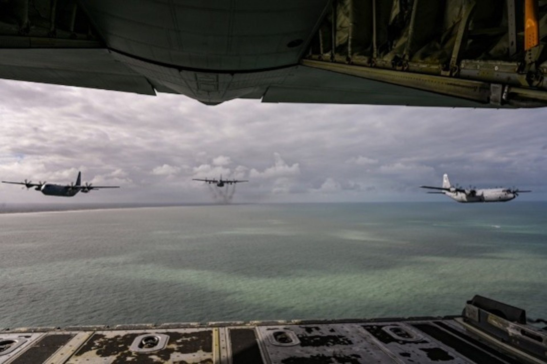 U.S. Air Force C-130 aircraft fly in formation over the coastal regions of France, June 05, 2026, in support of D-Day 82nd anniversary events in Normandy, France. The return of American aircraft to Normandy serves as a visible reminder of the enduring friendship between the people of France and the United States.