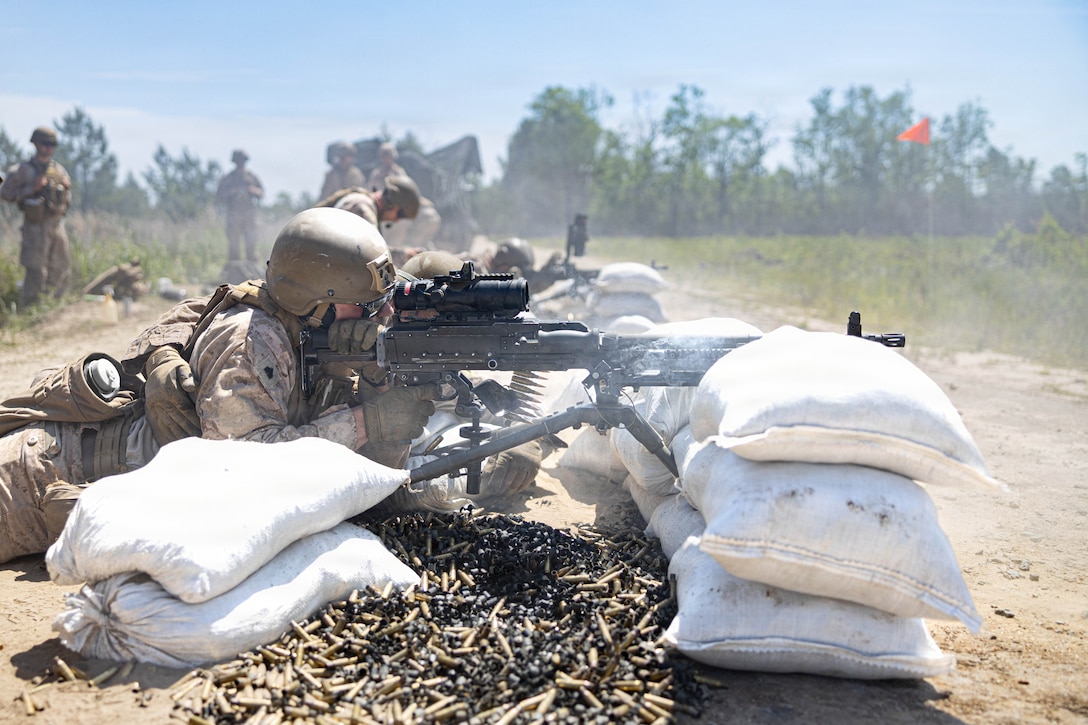 U.S. Marine Corps Sgt. Trent M. Rennie, combat engineer, Marine Wing Support Squadron 273, Marine Air Control Group 28, 2nd Marine Aircraft Wing, fires an M240B machine gun while conducting a field exercise at Townsend Bombing Range, Georgia, May 6, 2026. This FEX was conducted to sustain MWSS-273’s proficiency in mission-essential tasks and increase readiness for the upcoming Weapons and Tactics Instructor course 1-27. (U.S. Marine Corps photo by Cpl. Isabella L. Renaud)